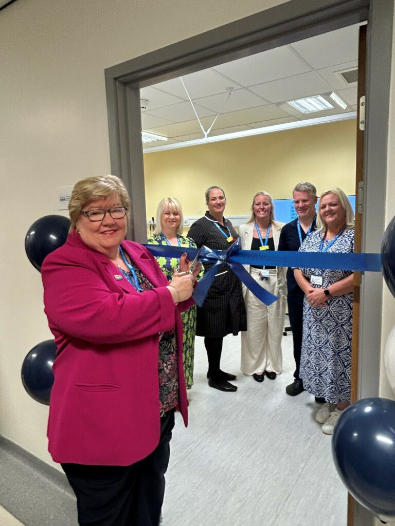 Picture of Anne Marr OBE, Chief Executive, cutting the ribbon along with; Anne Donald, Associate Directorate Manager, Wendy Harris, Quality Matron, Louise Derricott, Practice Manager, Professor Greg Irving, GP, Jacqueline Finn, Directorate Manager.